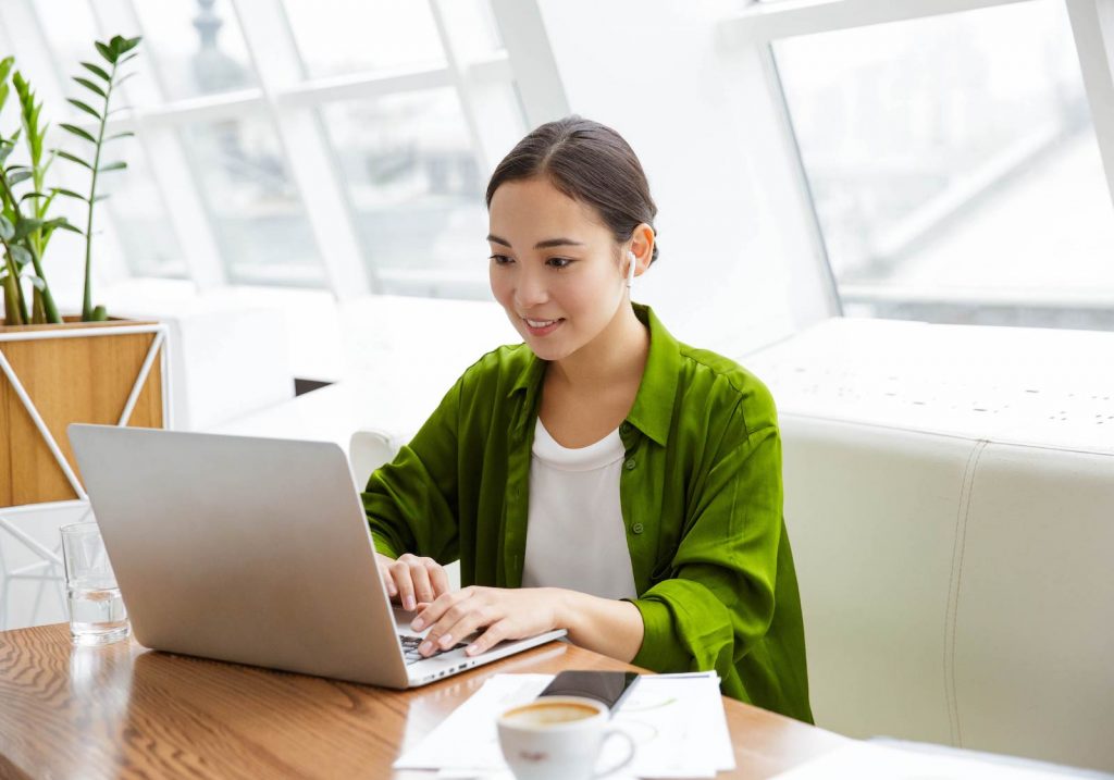 Person typing at a laptop computer