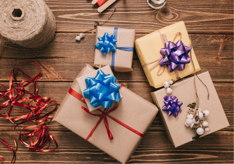 Wrapped holiday gifts and ribbons