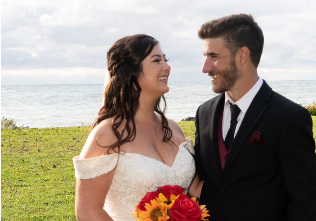 Bride and groom smiling and looking at each other