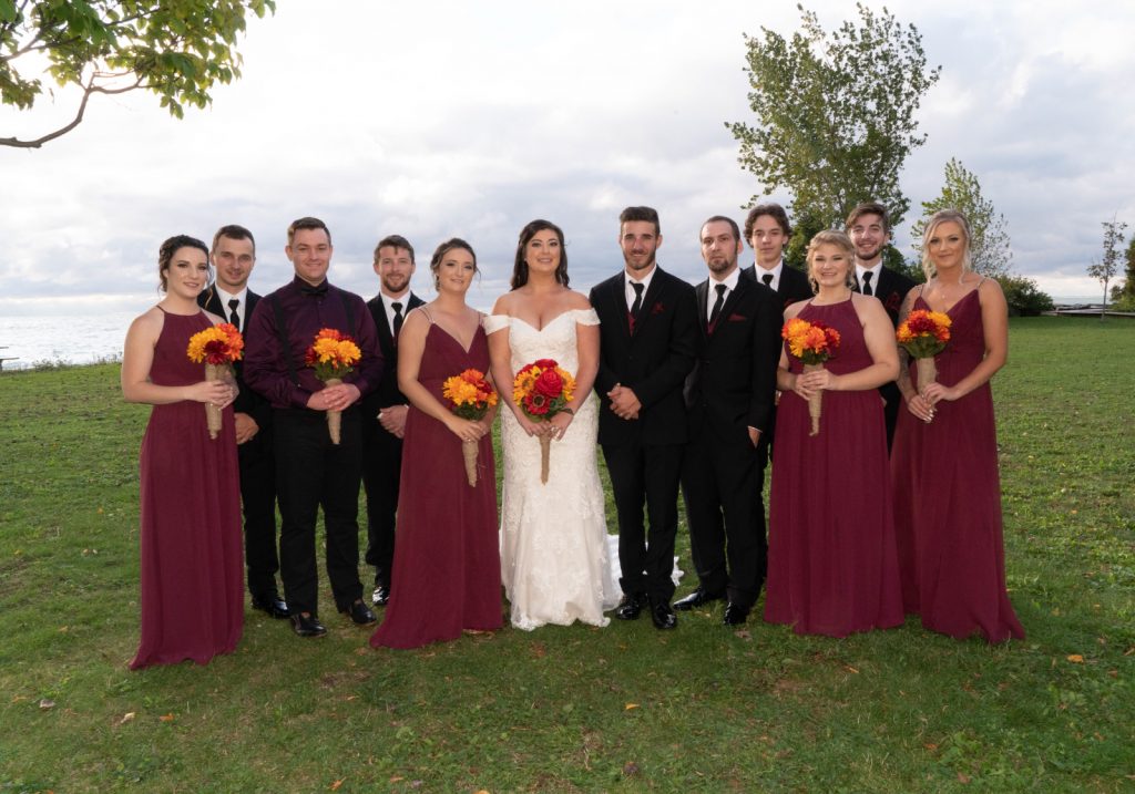A wedding party posing