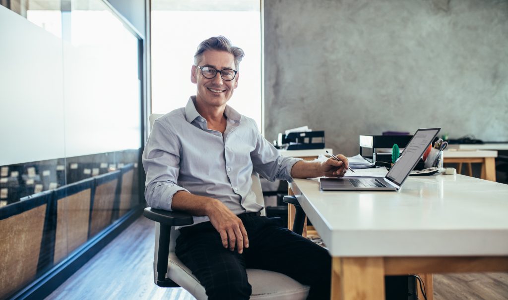 Mid adult businessman at work