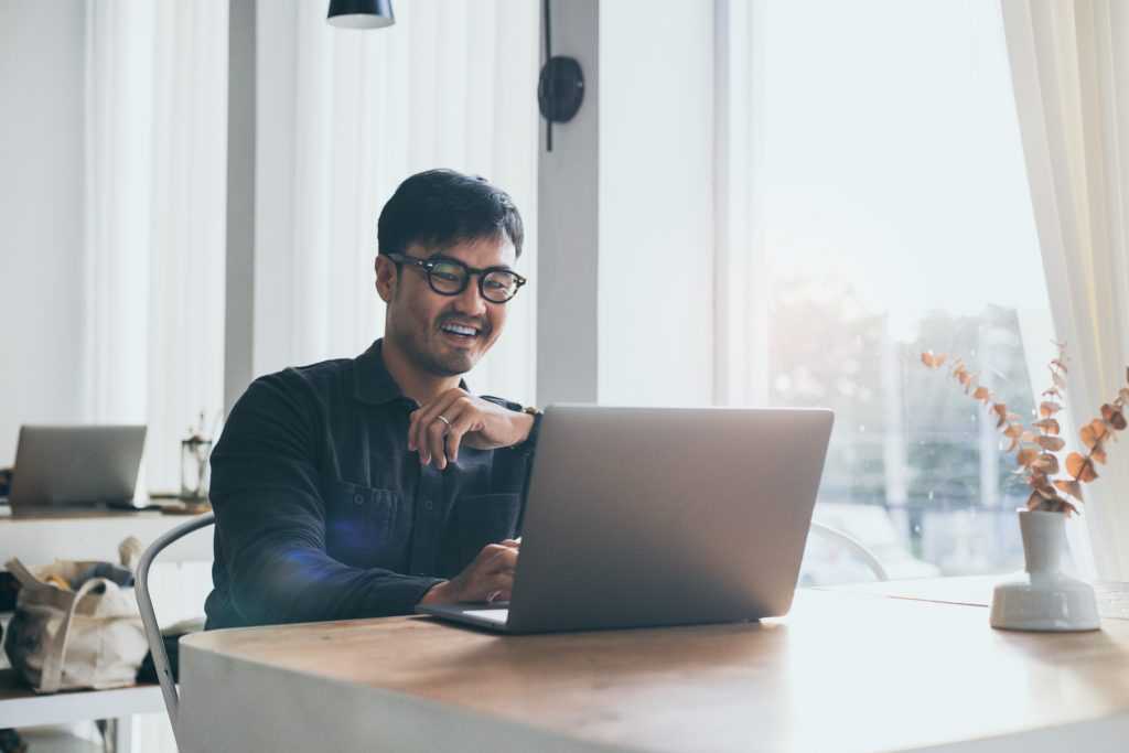 man work using computer hand typing laptop keyboard contact us online chatting search form internet sitting at office.concept for technology device communication business people