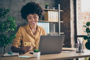 Woman smiling at computer