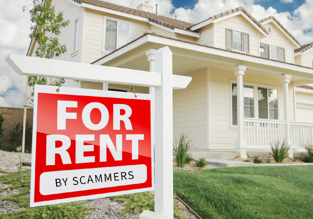 A house with a sign on the front lawn that reads 'for rent by scammers'