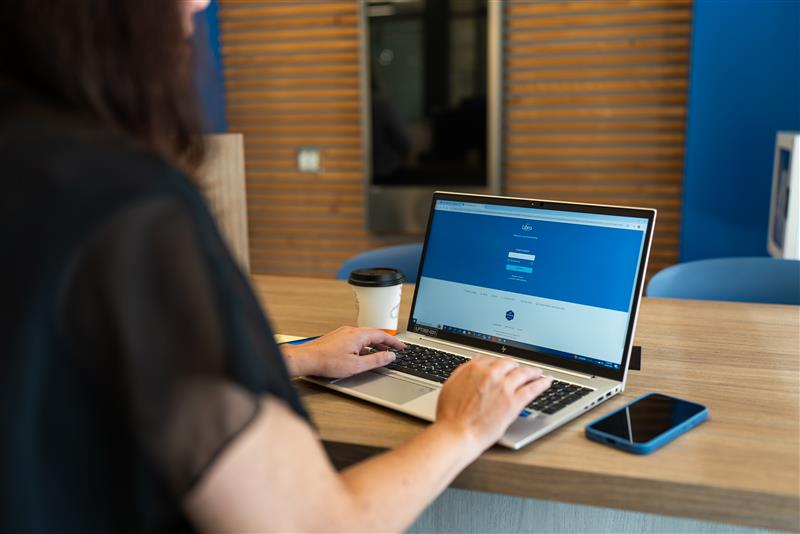 A person using a laptop to access online banking