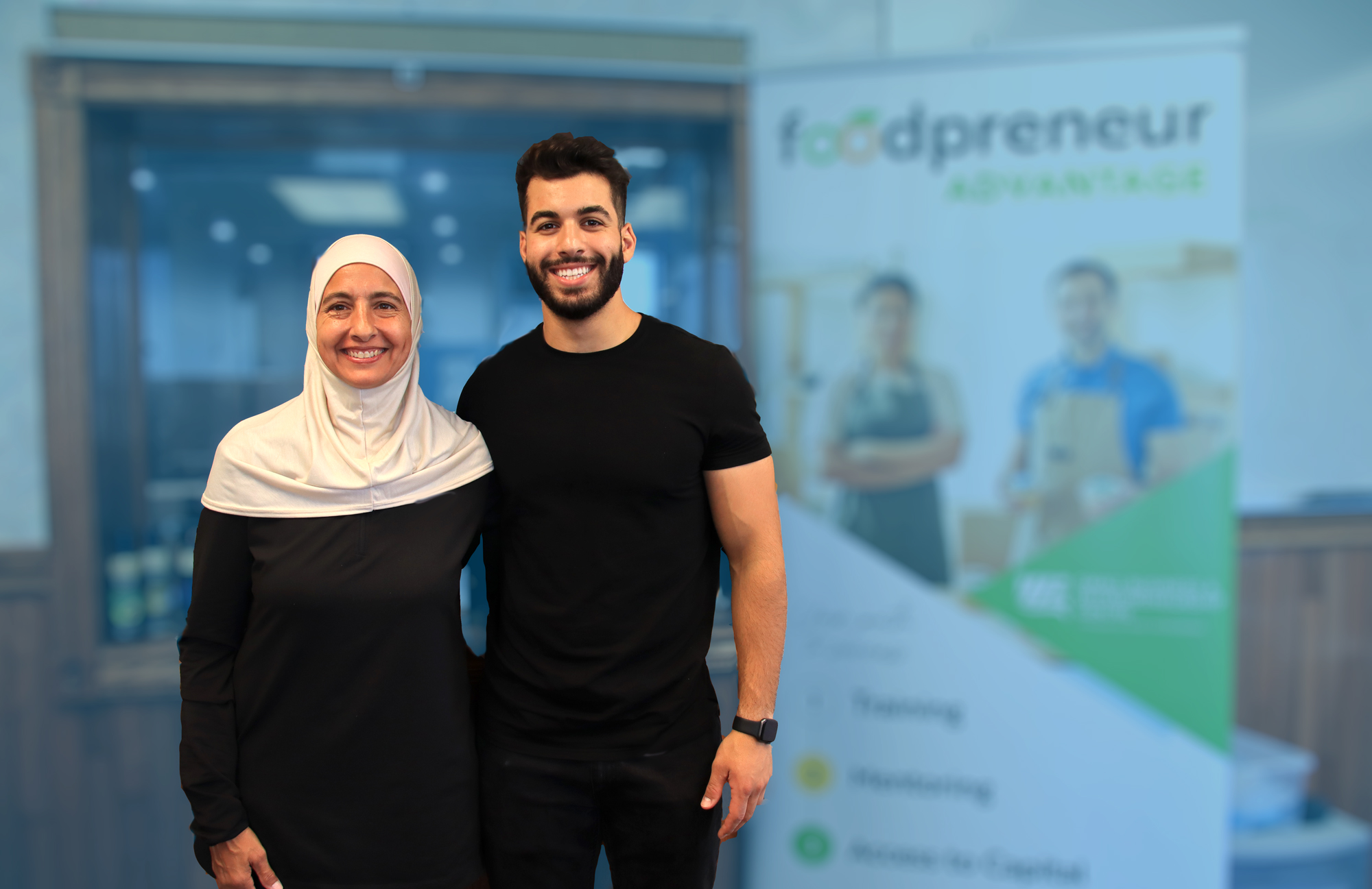 Two People with Foodpreneur Sign