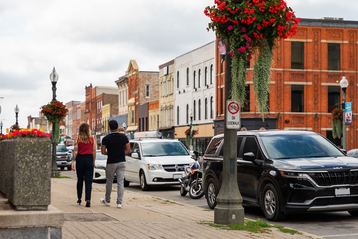Family walking down downtown Woodstock, Ontario