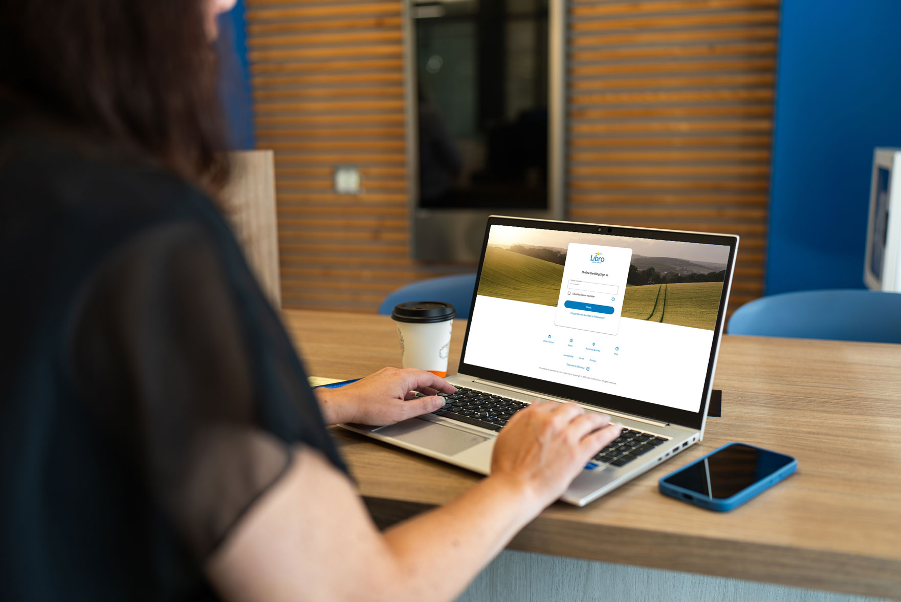 Person on laptop showing Libro Online Banking
