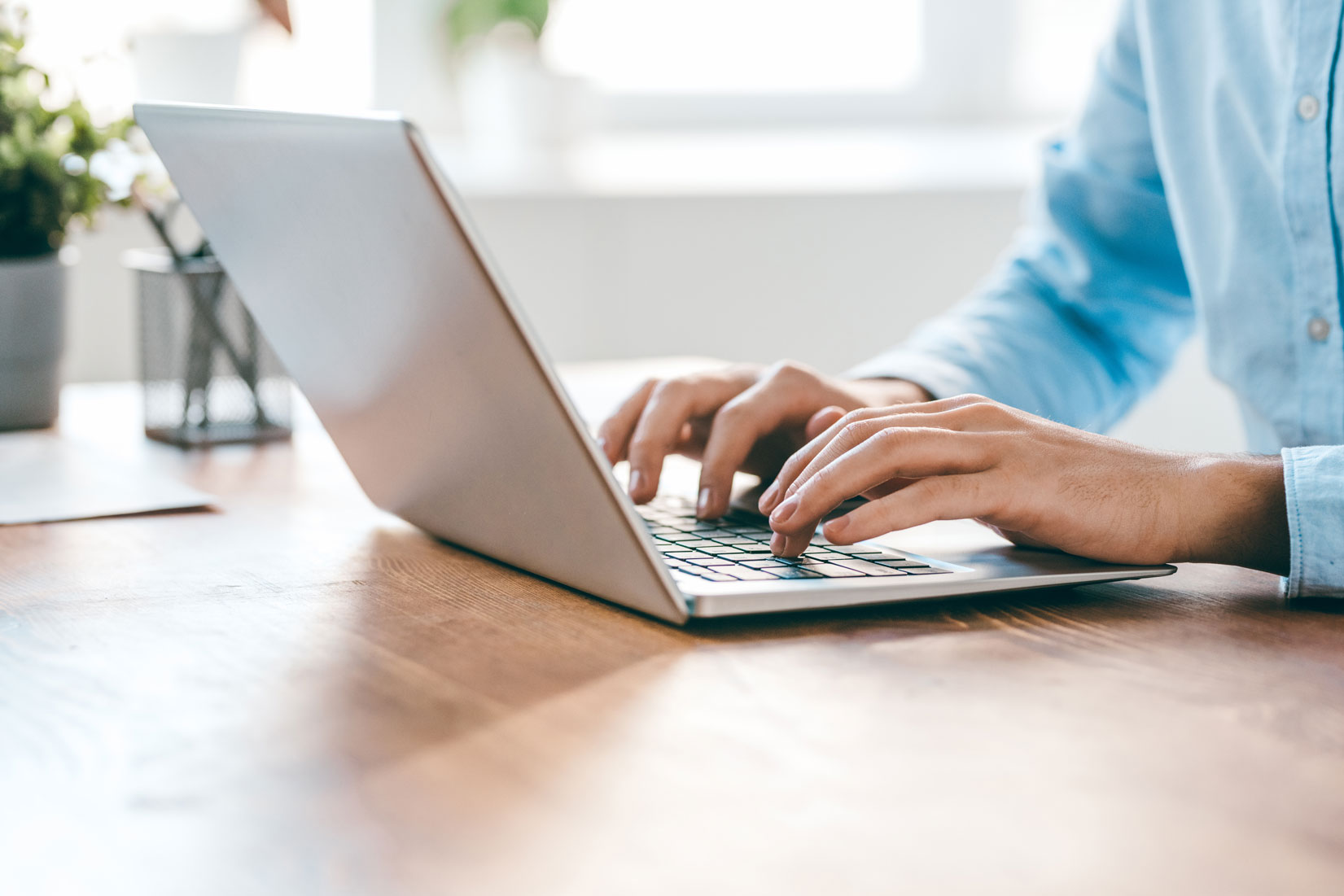 Person typing on laptop