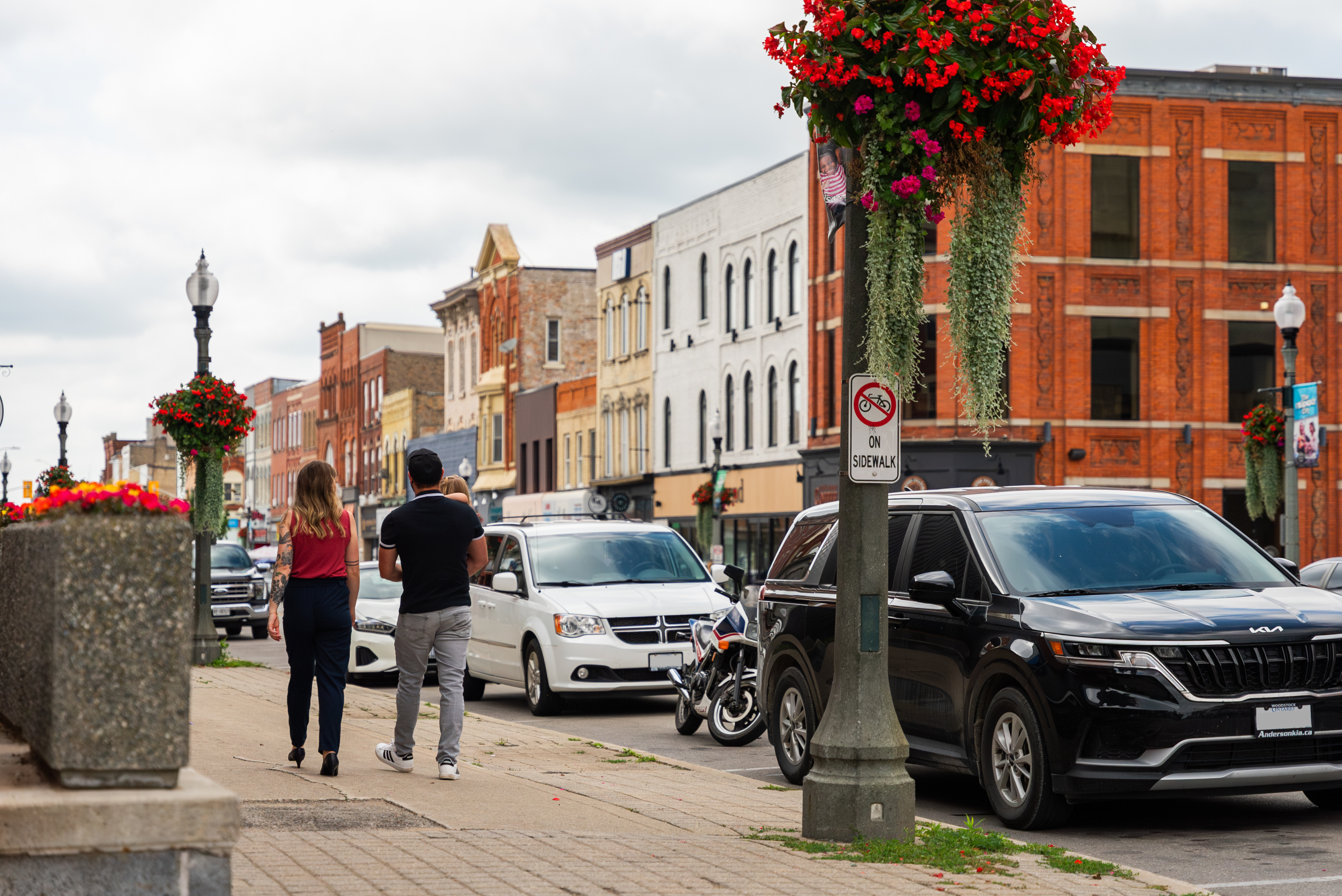 Family walking down the street in downtown Woodstock, Ontario