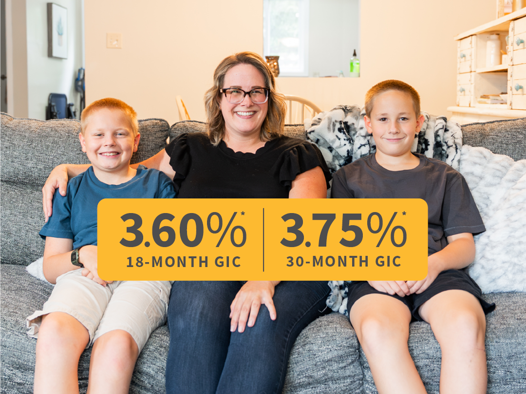 A woman and two boys sit on a couch, smiling, with a banner in front showing 3.60% 18-month GIC and 3.75% 30-month GIC interest rates.